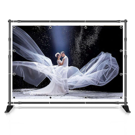 Bride in a flowing veil photographed against a white backdrop mounted on the adjustable aluminum crossbar backdrop stand