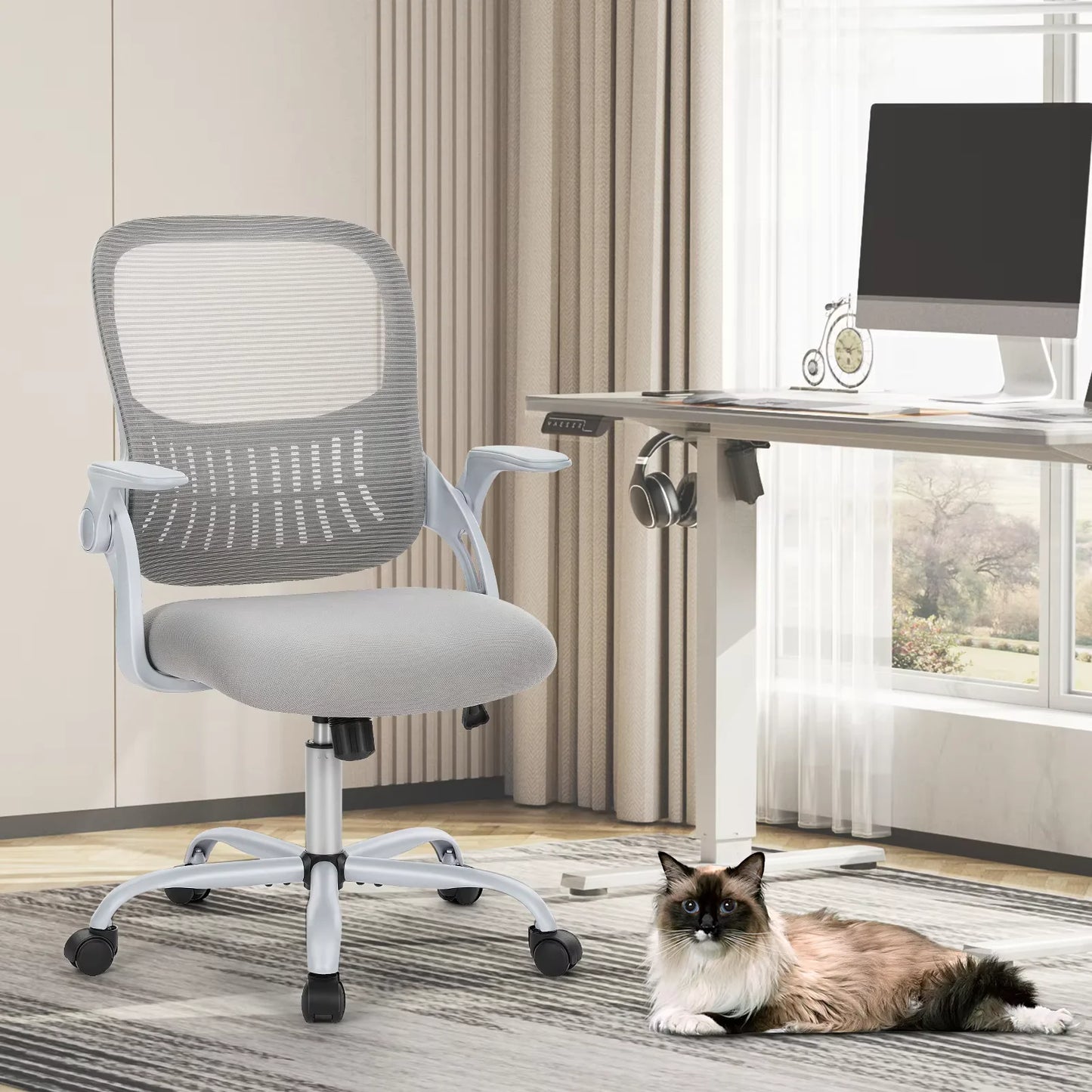 JHK C-3718 ergonomic mesh office chair in light gray beside a desk, with a cat nearby